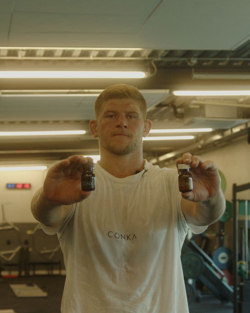 A CONKA athlete holding the daily shots